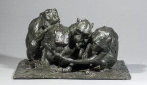 QUATRE SINGES DÉGUSTANT DES FRUITS